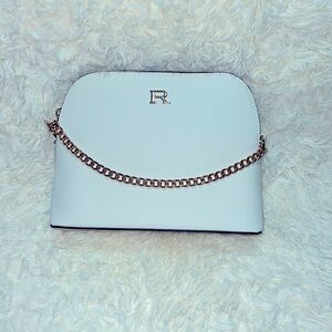 Rampage crossbody bag. Size W 9 1/3”- L 6 3/4”. Color off white.